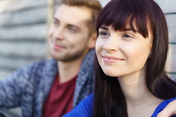 Dreamy pretty young woman with a beaming smile — Stok fotoğraf