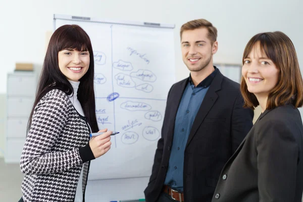 Enthusiastic business team working on a project — Stock Photo, Image
