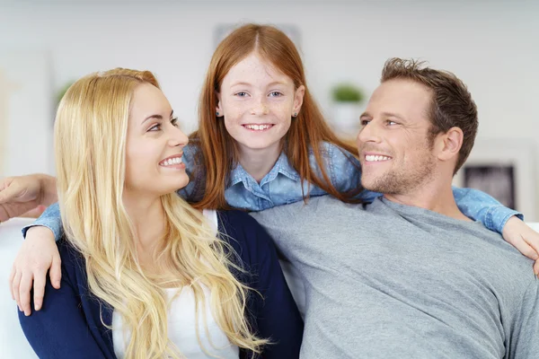 Relaxed happy family with a little daughter — Stock Photo, Image