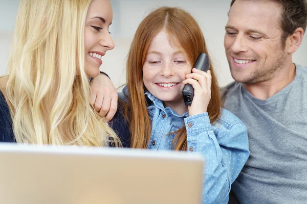 Smiling little girl chatting on a phone — Stock Photo, Image