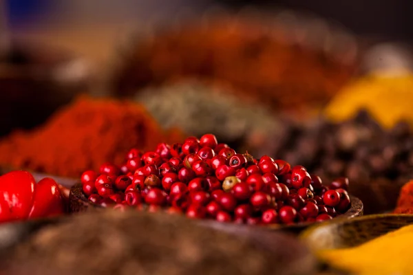 Spices in traditional Asian theme on wooden table — Stock Photo, Image