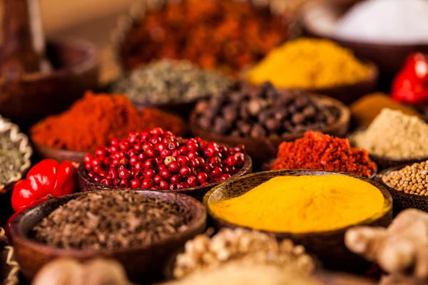 Spices in traditional Asian theme on wooden table — Stock Photo, Image