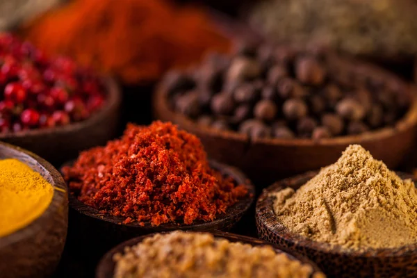 Wooden table of colorful spices — Stock Photo, Image