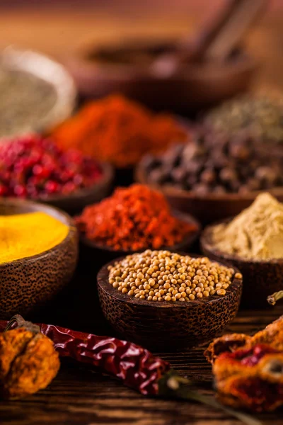 Wooden table of colorful spices — Stock Photo, Image