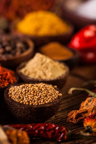 Plenty of traditional Asian spices in wooden bowls — Stock Photo, Image