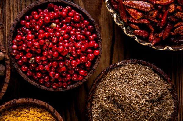 Spices in wooden Indonesian bowls — Stock Photo, Image