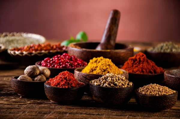 Hot spices in wooden bowls