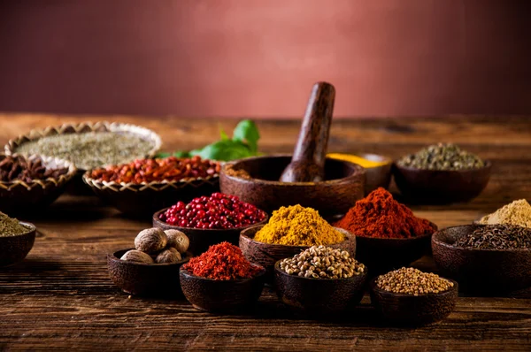 Hot spices in wooden bowls