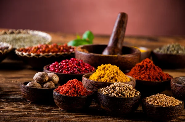 Hot spices in wooden bowls — Stock Photo, Image