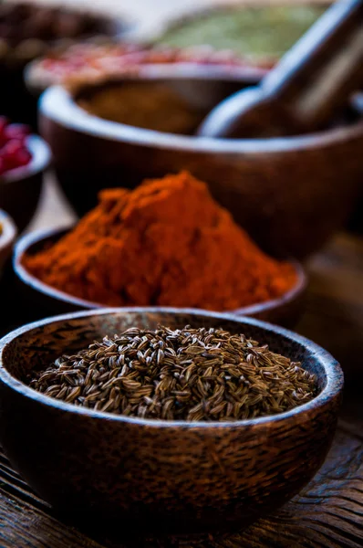 Hot spices in bowls, oriental theme — Stock Photo, Image
