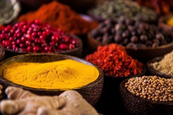 Wooden table of hot spices — Stock Photo, Image