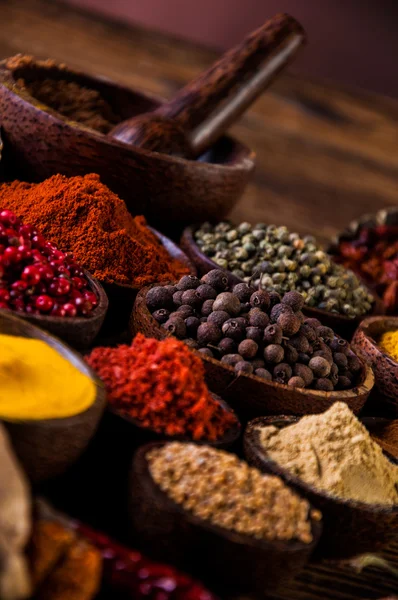 Wooden table of hot spices — Stock Photo, Image