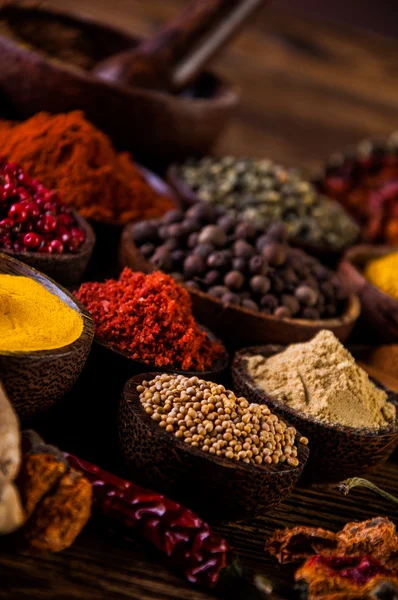 Wooden table of hot spices — Stock Photo, Image