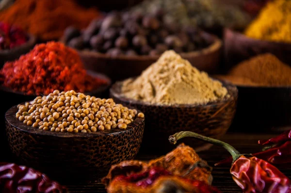 Wooden table of traditional Asian spices — Stock Photo, Image