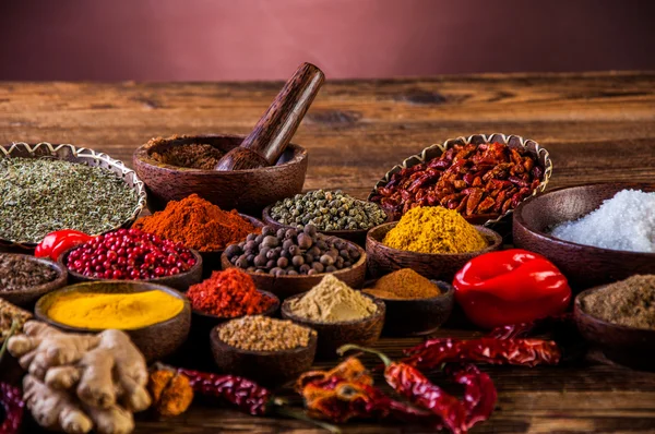 Variability of Asian spices on wooden table — Stock Photo, Image