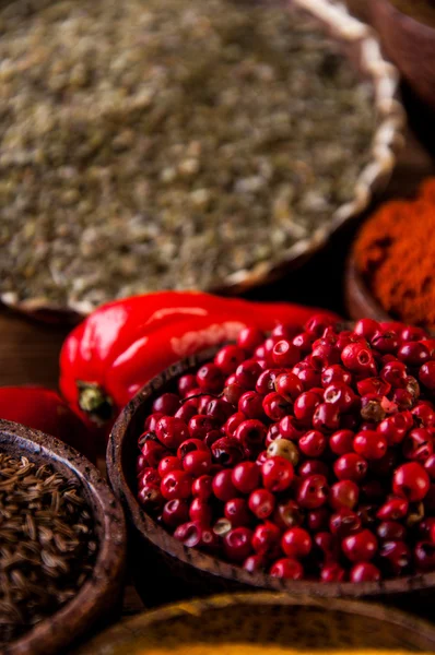 Oriental hot spices on wooden table — Stock Photo, Image