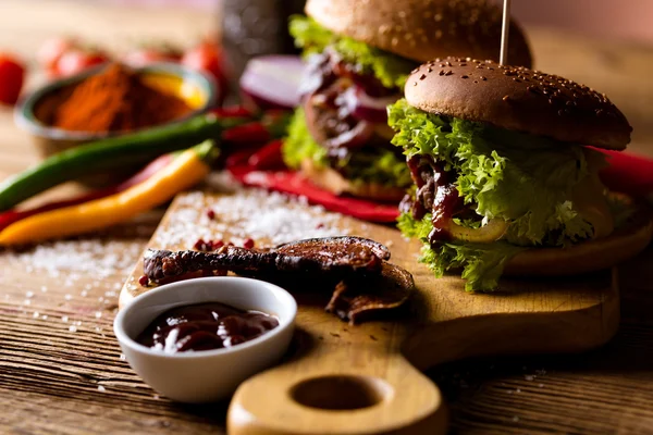 American burgers with spices, hot grilling meat — Stock Photo, Image