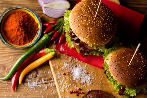 American burgers with spices, hot grilling meat — Stock Photo, Image