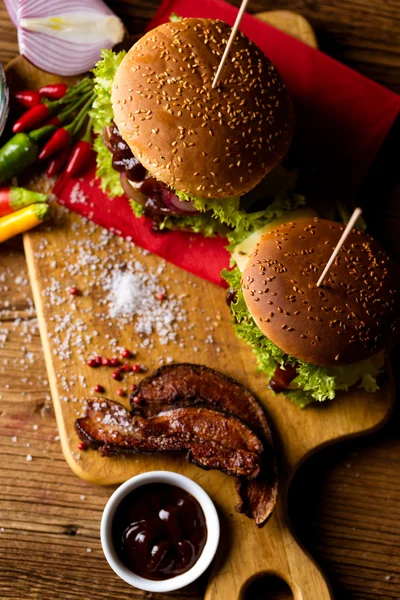 American burgers with spices, hot grilling meat