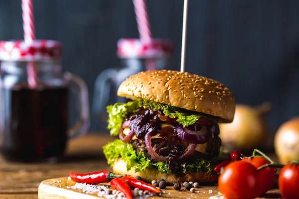 Hot burgers on wooden table, fresh traditional food — Stock Photo, Image