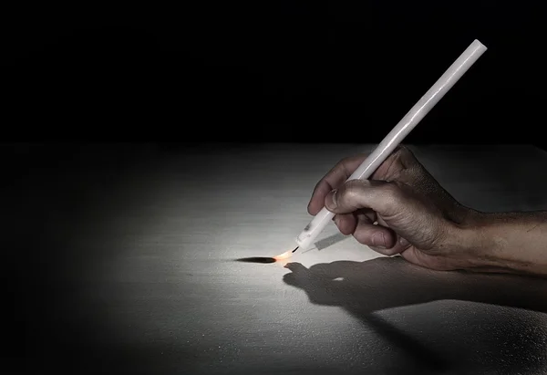 The hand of the artist, Candle-brush. — Stock Photo, Image