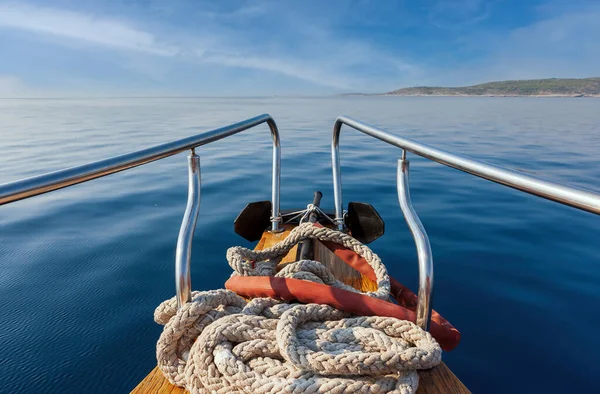 Sea anchor with a rope on the bow of the ship