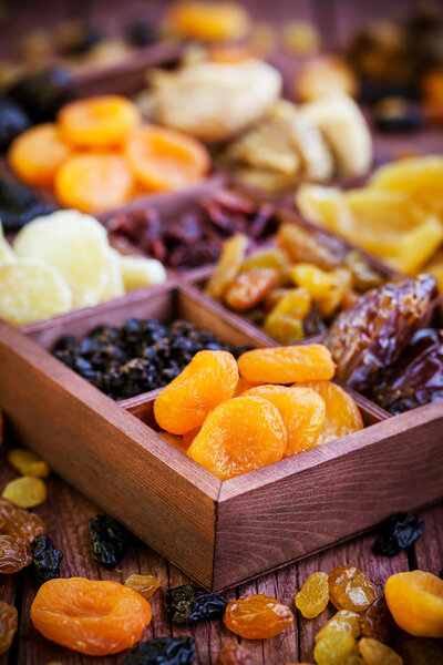 Assorted dried fruits in wooden box