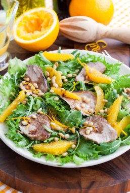Duck breast and orange salad clipart