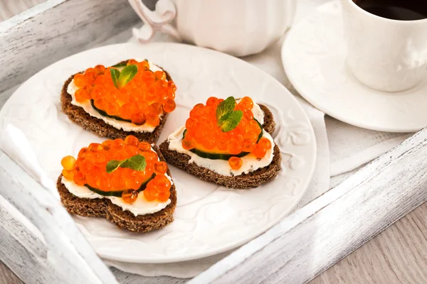 Romantic breakfast-toasts  with red caviar and coffee — Stock Photo, Image