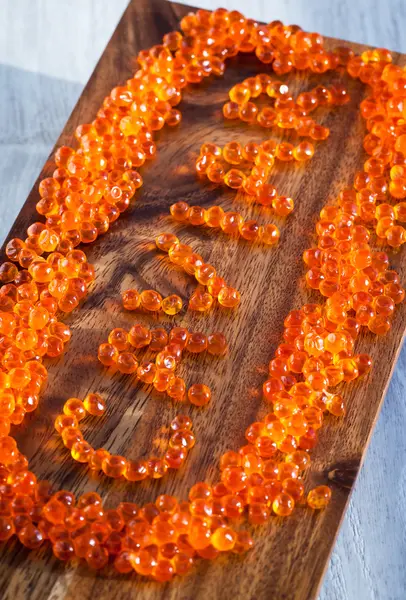 The word Caviar made from red caviar — Stock Photo, Image