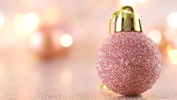 Rosa Ouro Brilho Ornamento Natal Com Luzes Piscando Sobre Tema — Vídeo de Stock