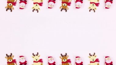 Noel geyikleri ve Santa Clouse beyaz temanın üstünde ve altında görünür. Hareketi durdur