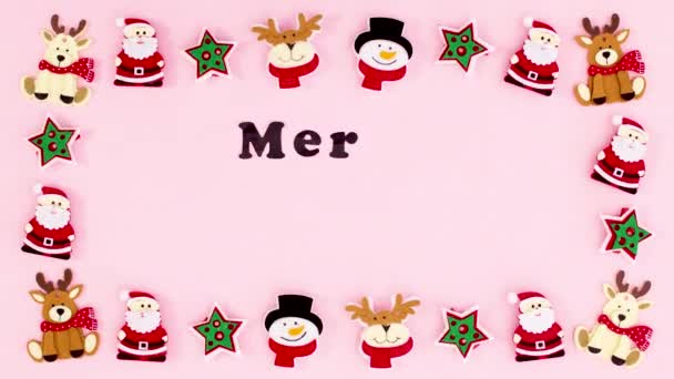 圣诞快乐的文字出现在圣诞玩具的框架中 停止运动 — 图库视频影像