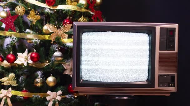 Vintage Televizyon Çalışmıyor Arkasında Yanıp Sönen Işıklar Olan Noel Ağacı — Stok video