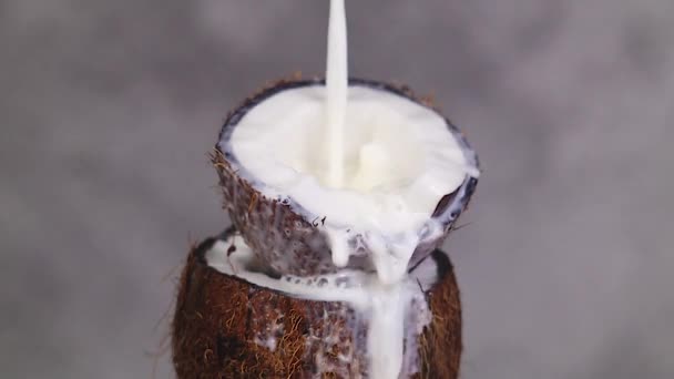 Super Slow Motion Milk Splashing Half Coconut — Stock Video