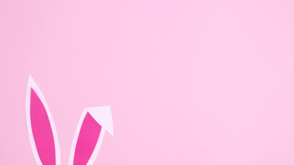 Bunny Ears Appear Pastel Pink Background Easter Minimal Flat Lay — Stock Video