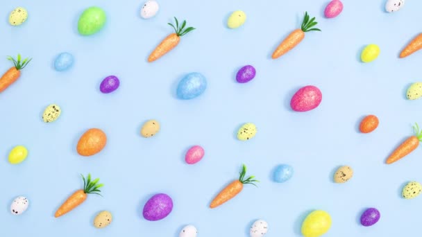 Creative Easter Vibrant Pattern Made Eggs Carrots Pastel Blue Background — Stock Video