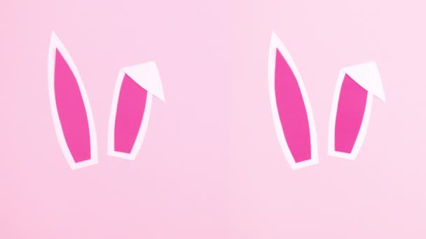 双花绽放的兔子耳朵复活节在粉红的背景上 停止运动 — 图库视频影像