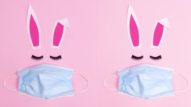 Dos Conejito Pascua Con Máscaras Faciales Sobre Fondo Rosa Pastel — Vídeo de stock