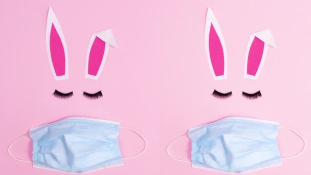 Dos Conejito Pascua Con Máscaras Faciales Sobre Fondo Rosa Pastel — Vídeos de Stock