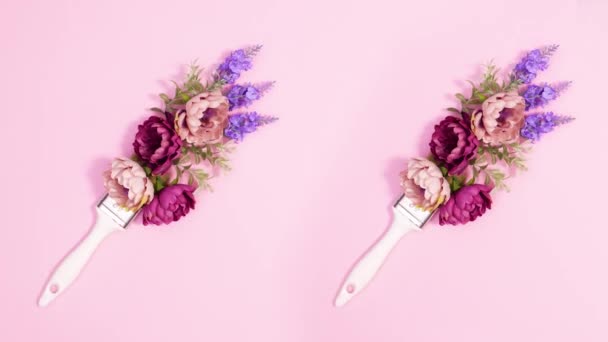 Две Креативные Кисти Цветочным Декором Розовом Фоне Стоп Движение — стоковое видео