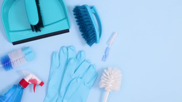 Household Cleaning Tools Move Blue Background Copy Space Stop Motion — Stock Video