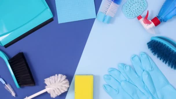 Household Cleaning Tools Make Frame Copy Space Dark Bright Blue — Stock Video