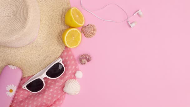 Summer Trendy Beach Accessories Appear Pastel Pink Background Stop Motion — Stock Video