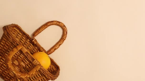 Citrus Fruits Appear Wooden Basket Beige Background Stop Motion — Vídeos de Stock