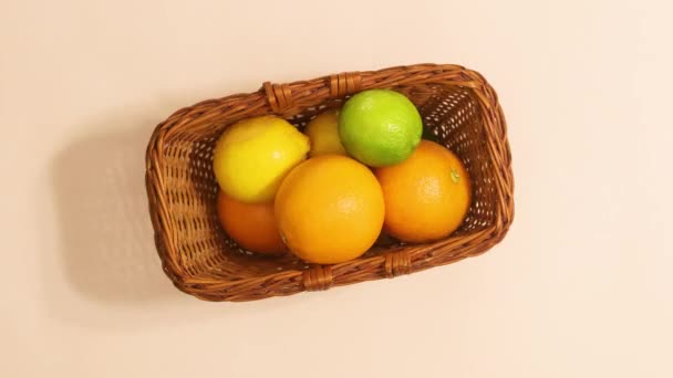 Wooden Basket Citrus Fruits Move Beige Background Stop Motion Flat — Vídeos de Stock