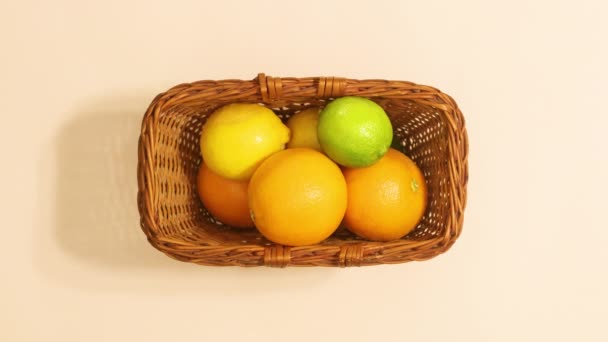 Wooden Basket Citrus Fruits Appear Stop Beige Background Looping Stop — Vídeo de Stock