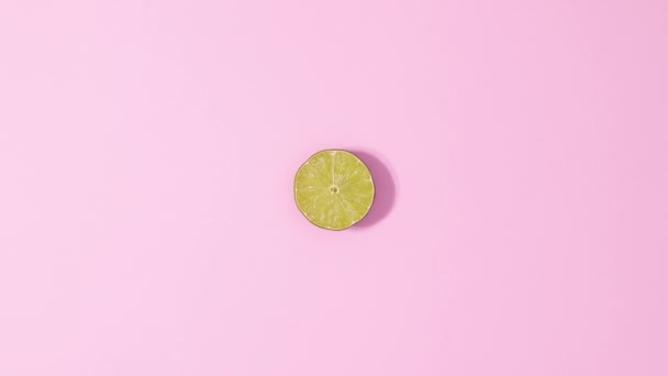 Citrus Lime Fruit Rotating Pastel Pink Background Stop Motion — Vídeos de Stock