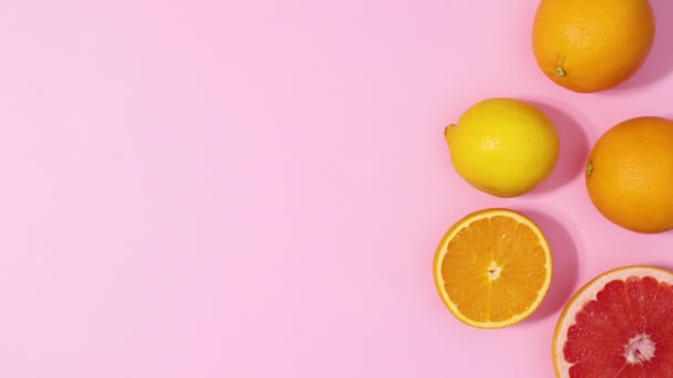 Fresh Citrus Fruits Appear Right Side Pastel Pink Background Copy — Stockvideo