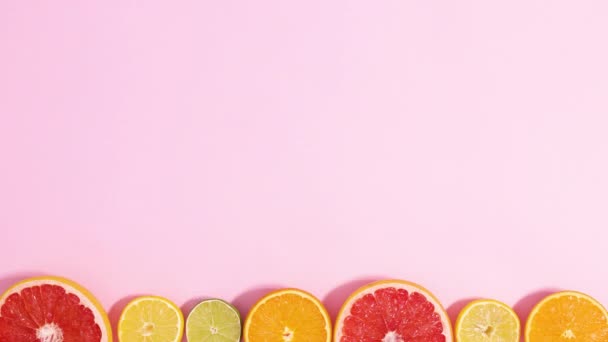 Sliced Citrus Fruits Move Bottom Bright Pink Background Copy Space — 图库视频影像